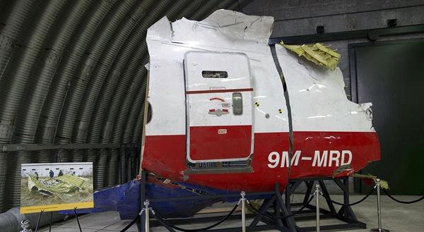 Wreckage of the MH17 airplane is seen after the presentation of the final report into the crash of July 2014 of Malaysia Airlines flight MH17 over Ukraine, in Gilze Rijen, the Netherlands