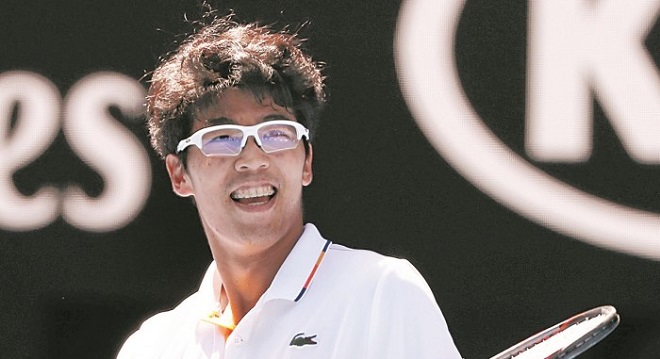 2018-01-24T044623Z_1795416442_HP1EE1O0D9AXD_RTRMADP_3_TENNIS-AUSOPEN