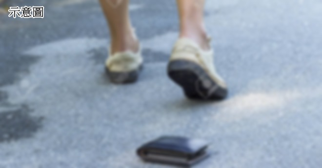 black leather wallet drop on the road.