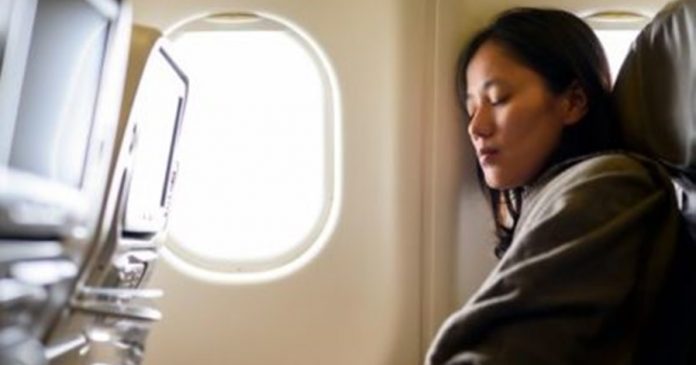 0_Woman-sleeping-on-airplan-416x312