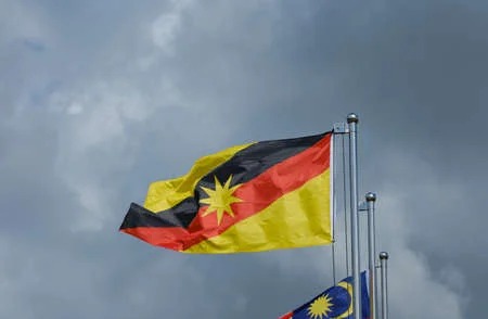183779635-a-picture-of-sarawak-flag-waving-during-cloudy-day-sarawak-is-a-state-east-of-malaysia-at-borneo