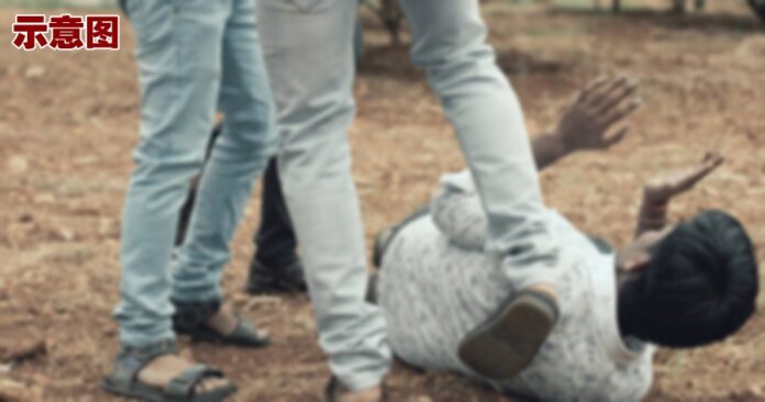 concept-of-mob-lynching-group-of-people-bullying-kicking-a-man-close-up-of-young-adult-males