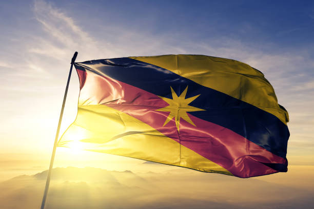 sarawak-state-of-malaysia-flag-textile-cloth-fabric-waving-on-the-top-sunrise-mist-fog
