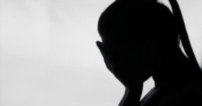 woman covering face