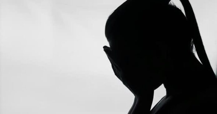 woman covering face