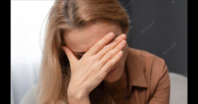 woman-covering-face-with-hand_23-2148759098