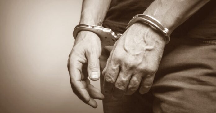male hands in handcuffs